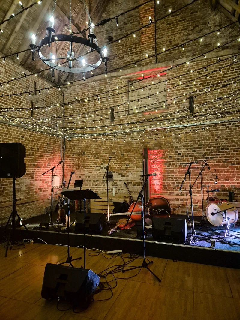 Instruments and lights set up on a barn stage