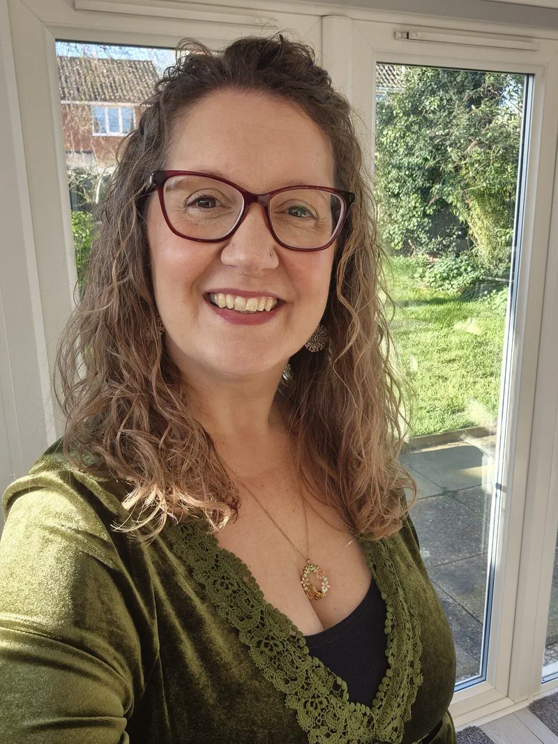 Sarah smiling outdoors