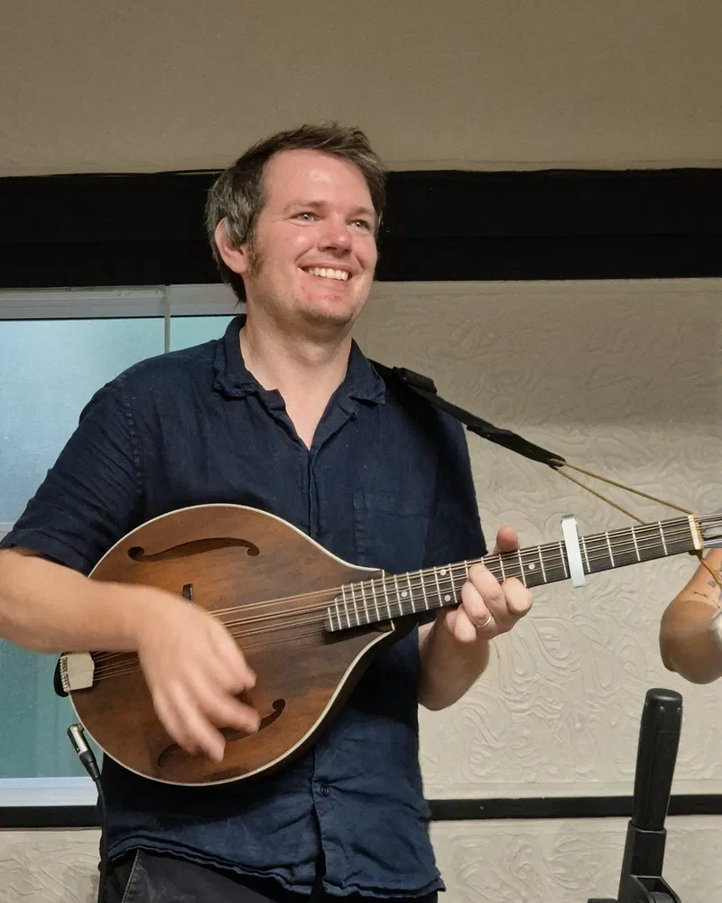 Tom playing mandolin